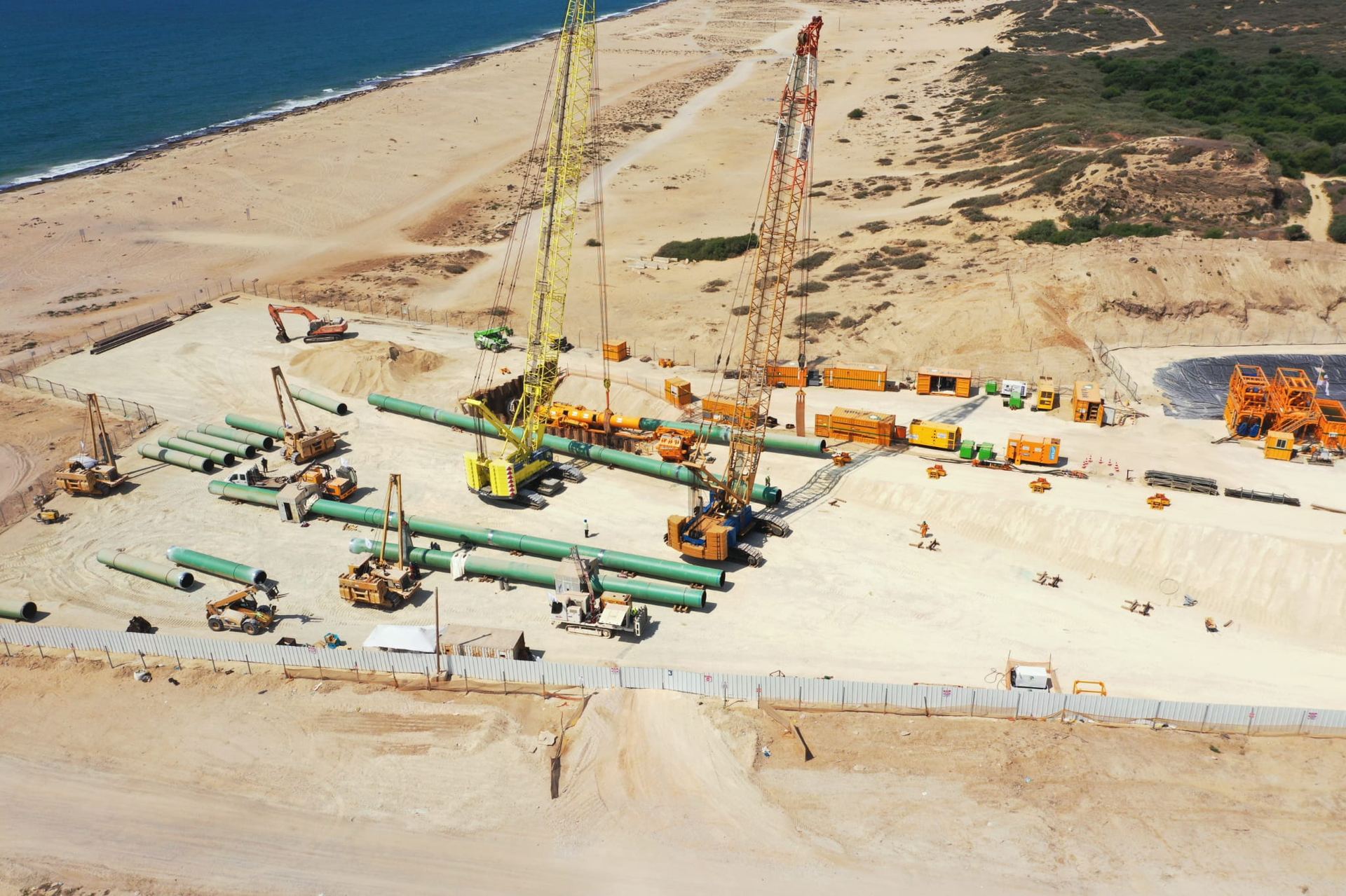 Ashdod onshore pipeline worksite — pipe staging and installation